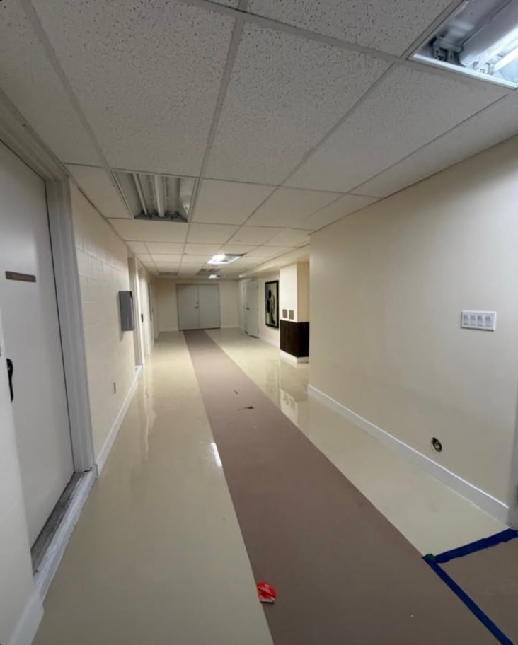 Finished hallway with fresh paint and polished flooring